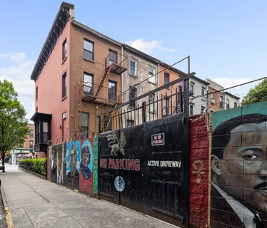 a front view of a building with retail shops