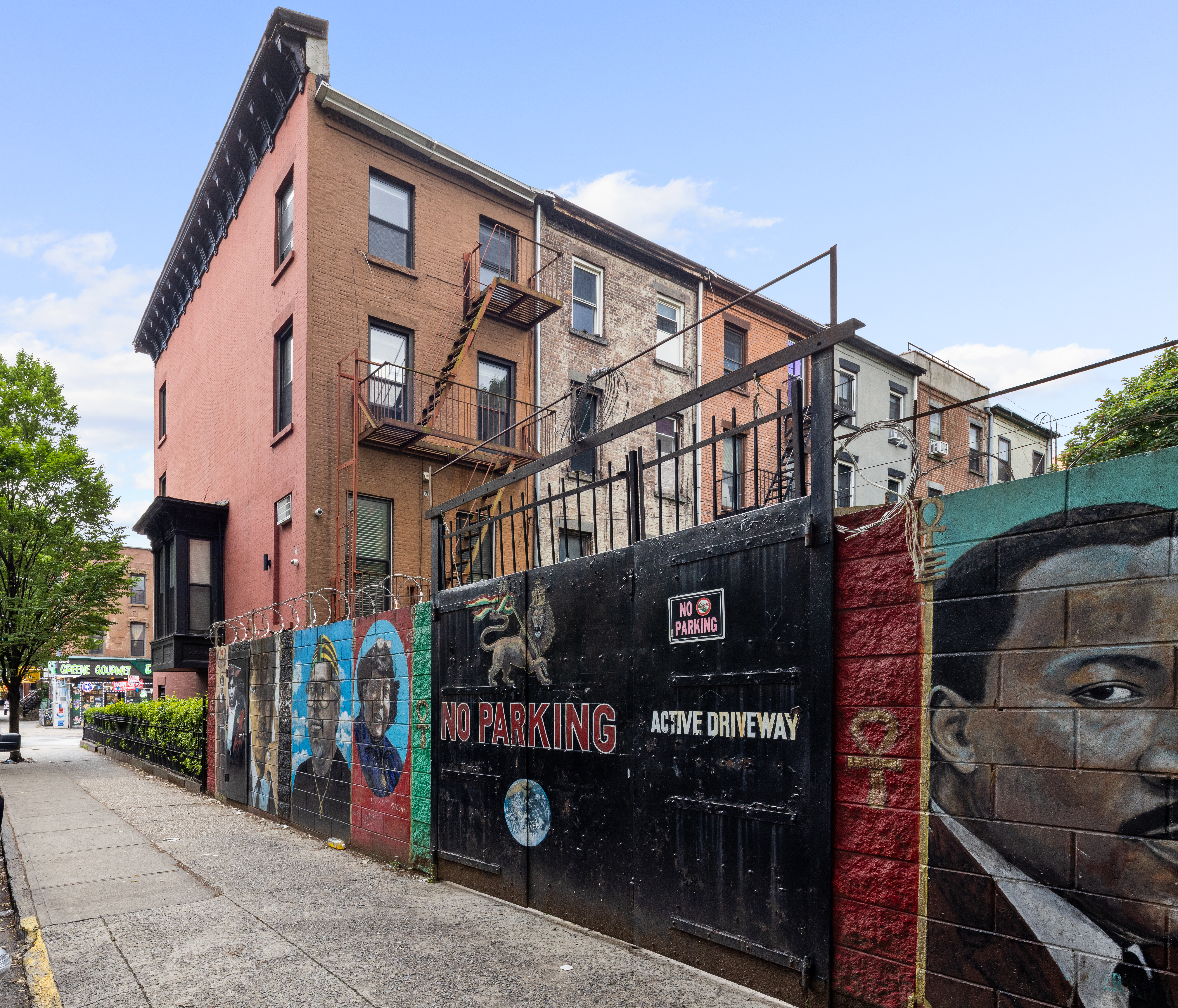 663 Greene Avenue Brooklyn, NY 11221 - Photo 12 of 14 a front view of a building with retail shops