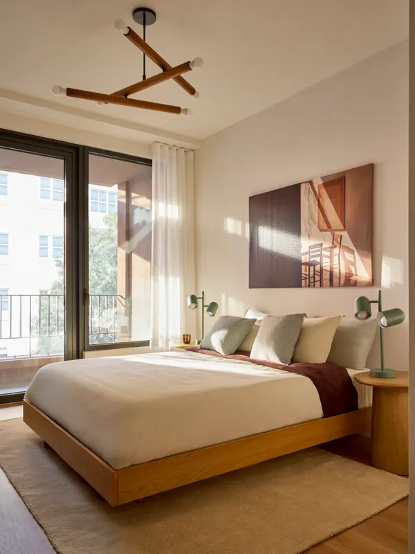 a bedroom with a large bed and a large window