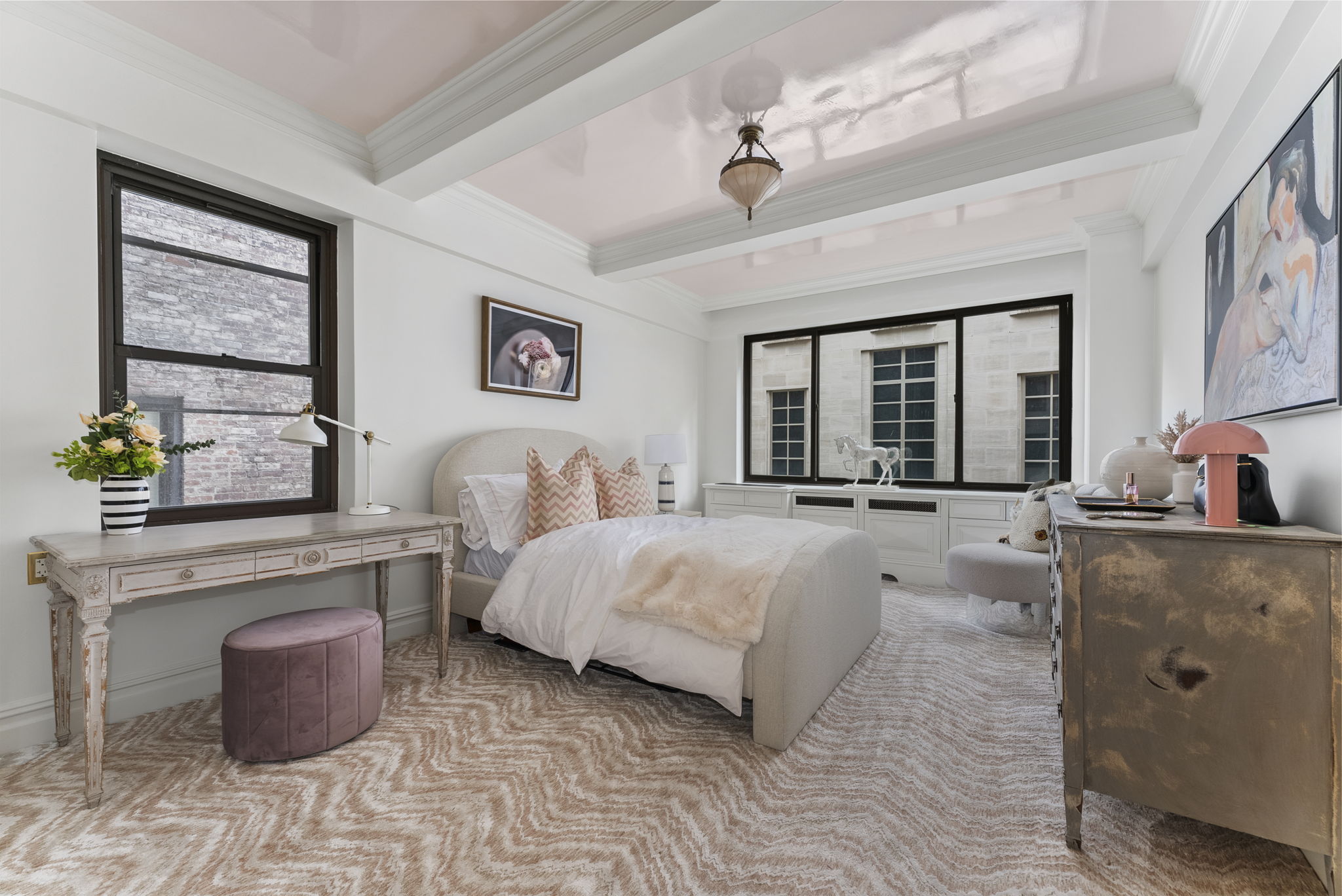 230 Central Park South, Unit 6DE Manhattan, NY 10019 - Photo 15 of 23 a bedroom with a large bed and a chandelier