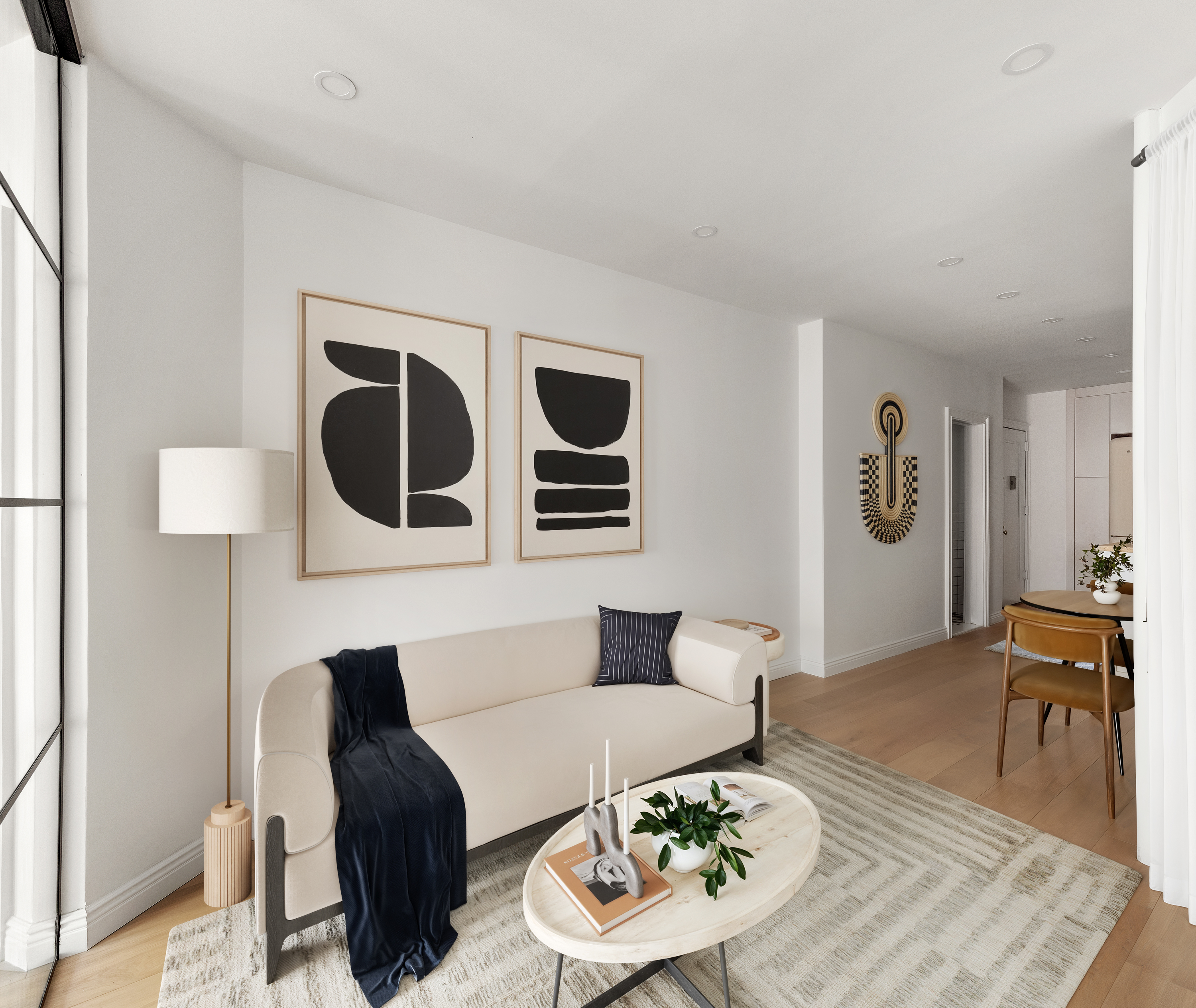 228 West 16th Street, Unit 4B Manhattan, NY 10011 - Photo 5 of 9 a living room with furniture and wooden floor