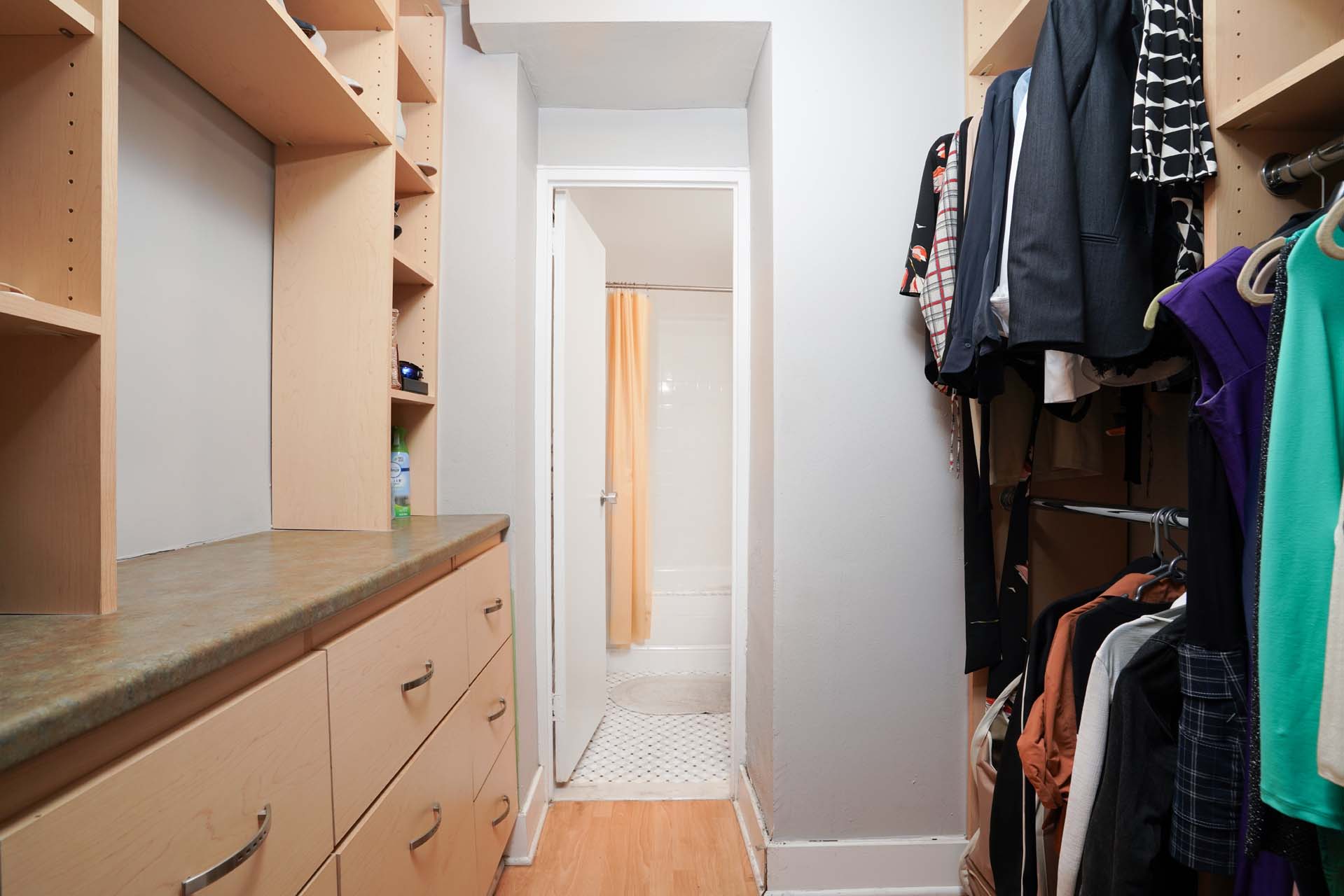 301 East 75th Street, Unit 2G Manhattan, NY 10021 - Photo 6 of 14 a view of walk in closet with clothes and shoes