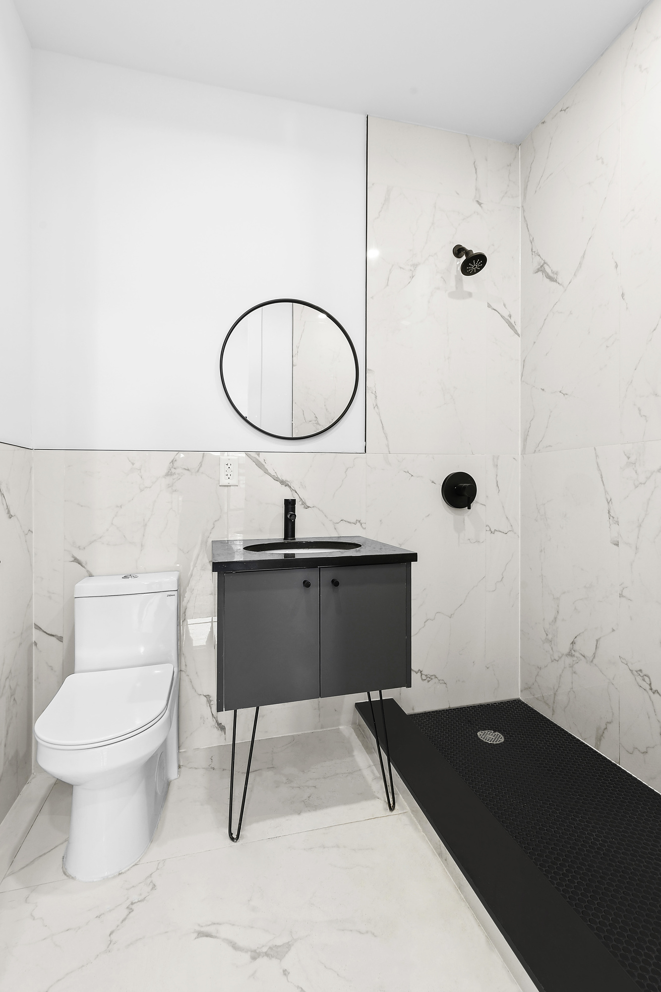 893 Knickerbocker Avenue, Unit 2 Brooklyn, NY 11207 - Photo 8 of 11 a bathroom with a granite countertop sink toilet a mirror and shower