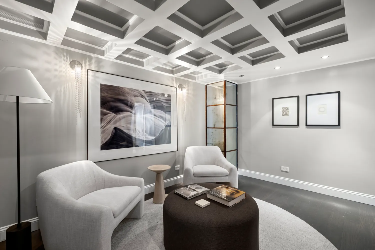 a living room with furniture and a potted plant