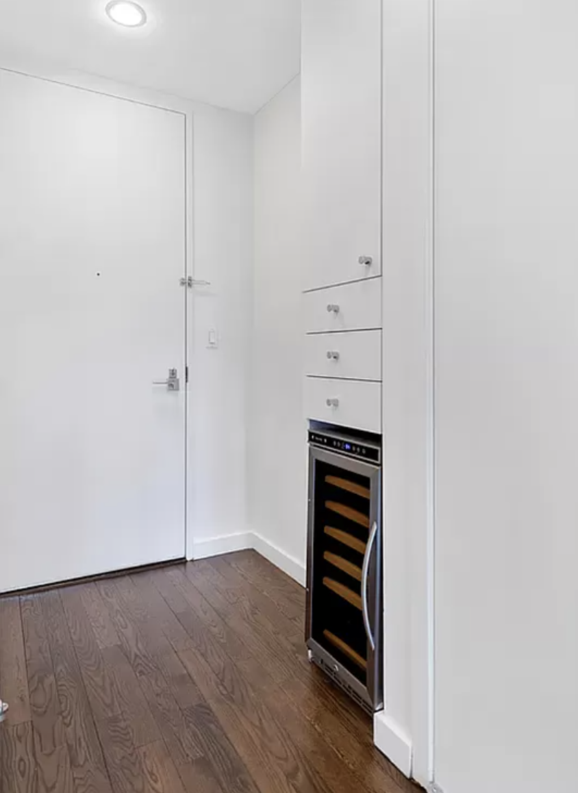 133 West 22nd Street, Unit 7H Manhattan, NY 10011 - Photo 9 of 22 a view of walk in closet with empty racks