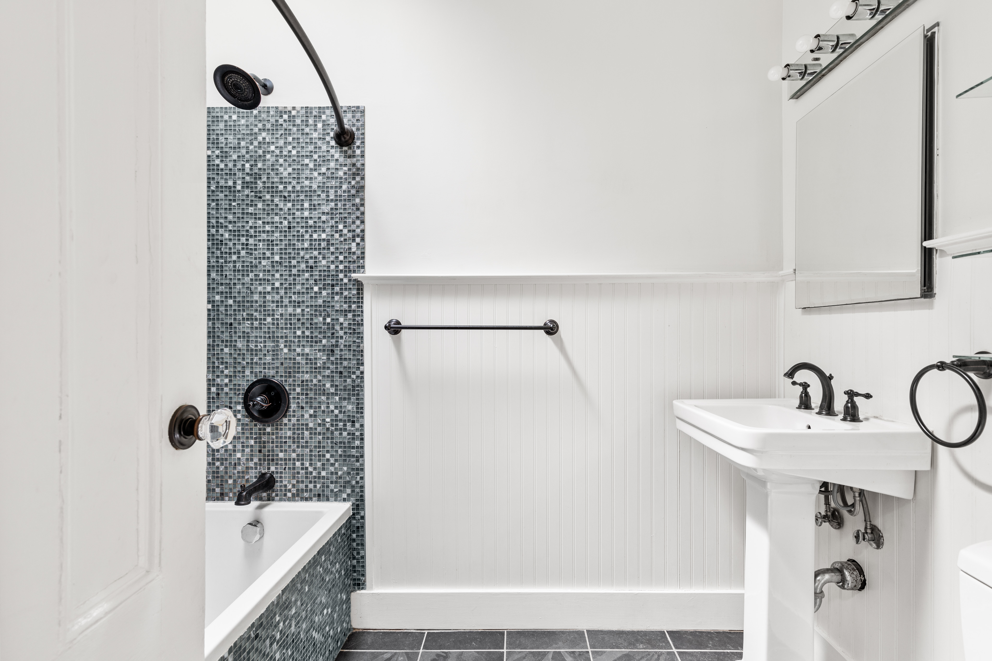 955 Bushwick Avenue Brooklyn, NY 11221 - Photo 8 of 19 a bathroom with a sink and mirror