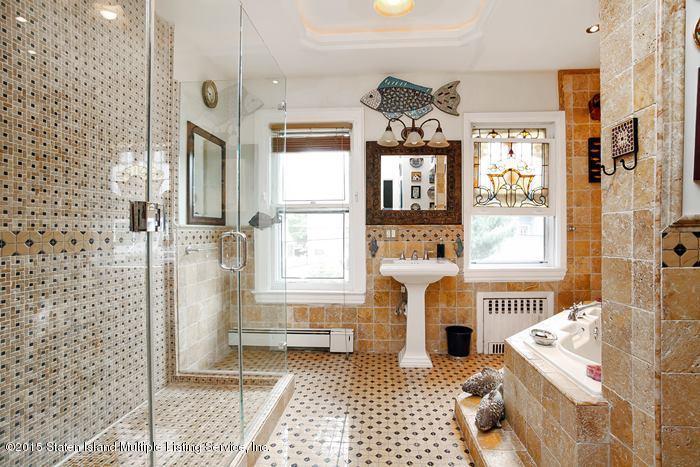 630 East 24th Street Brooklyn, NY 11210 - Photo 16 of 28 a living room with furniture and a fireplace