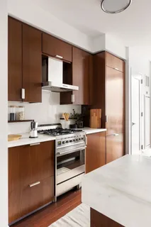 a kitchen with a sink cabinets and stainless steel appliances