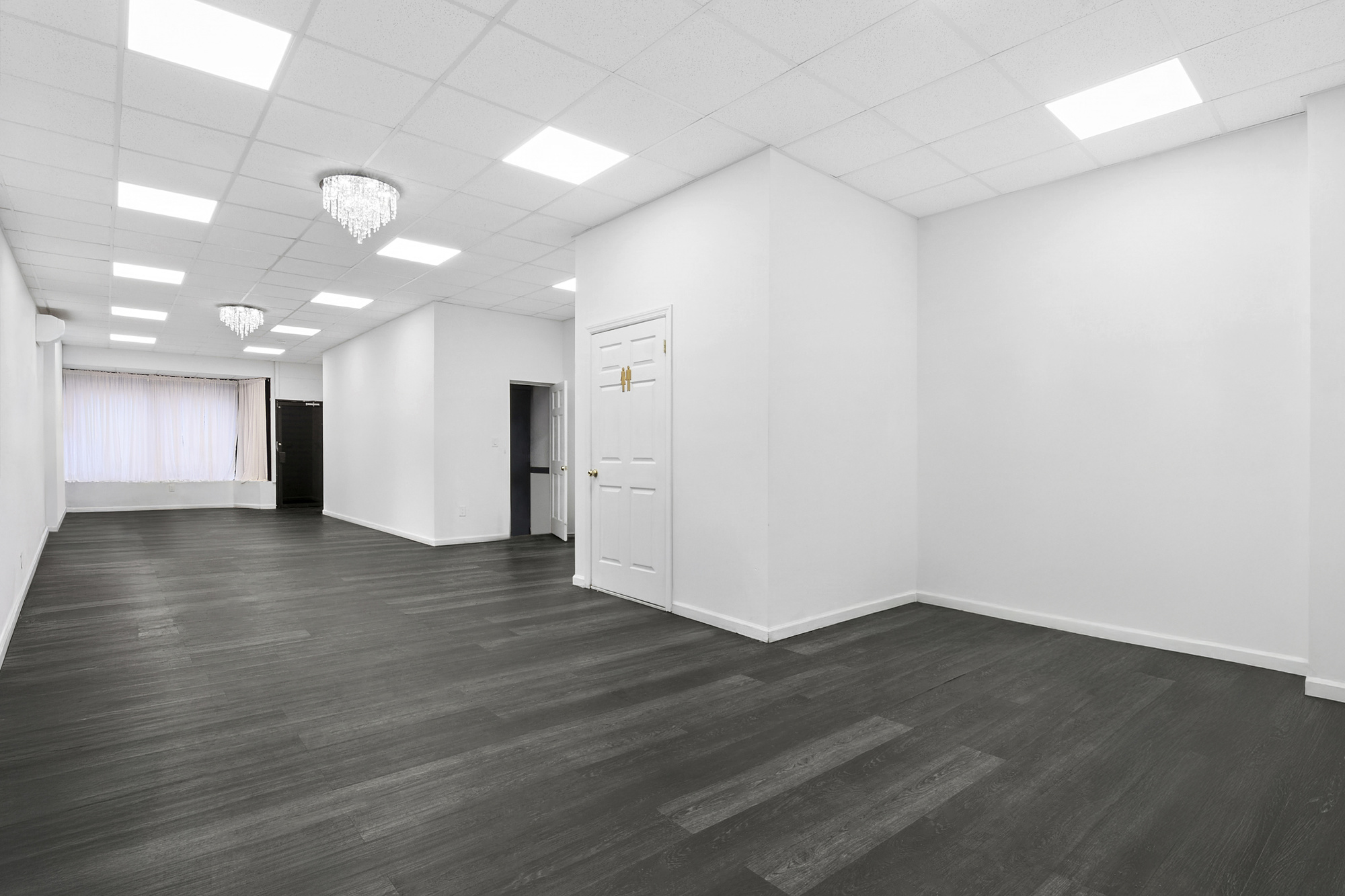 1541 Nostrand Avenue Brooklyn, NY 11226 - Photo 12 of 16 a view of a hallway with wooden floor