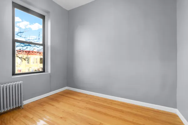 a view of a kitchen from a sink and a window