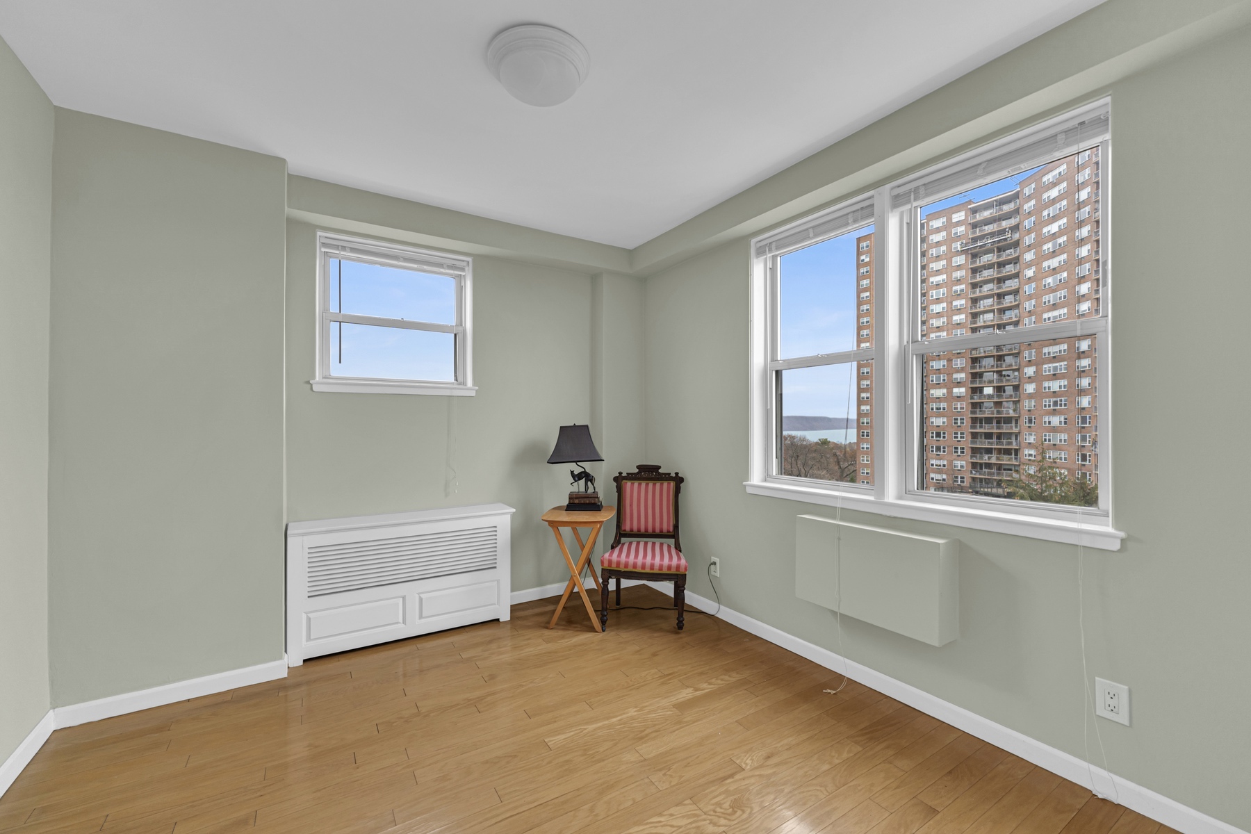 5800 Arlington Avenue, Unit 6V Bronx, NY 10471 - Photo 9 of 15 a living room with furniture and a window