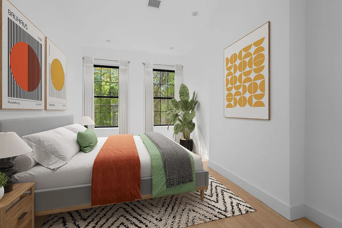 1242 Putnam Avenue, Unit 2 Brooklyn, NY 11221 - Photo 3 of 8 a bedroom with a bed and wooden floor