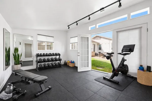 a bedroom with furniture and a flat screen tv