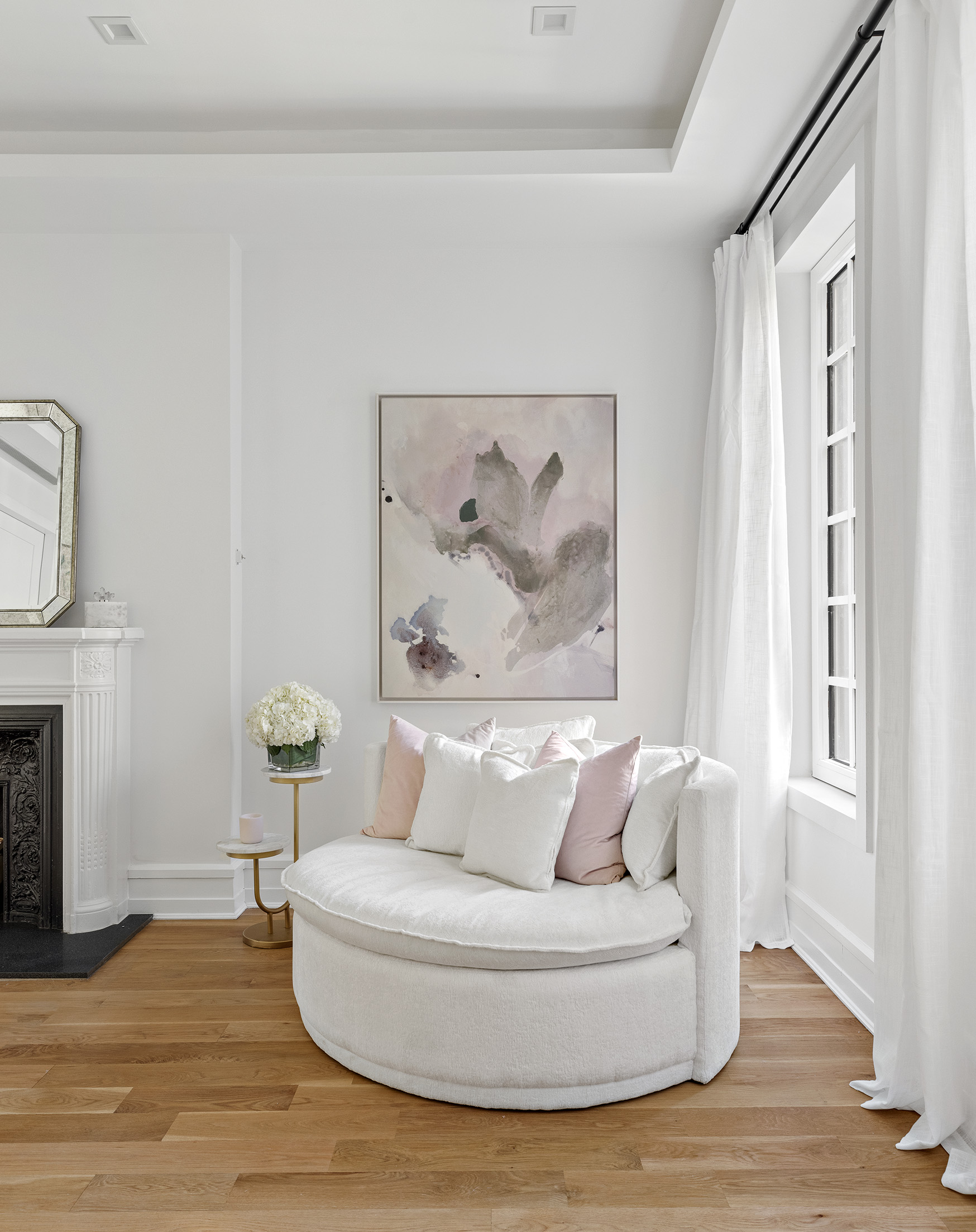 25 East 94th Street Manhattan, NY 10128 - Photo 15 of 33 a white couch sitting next to a window