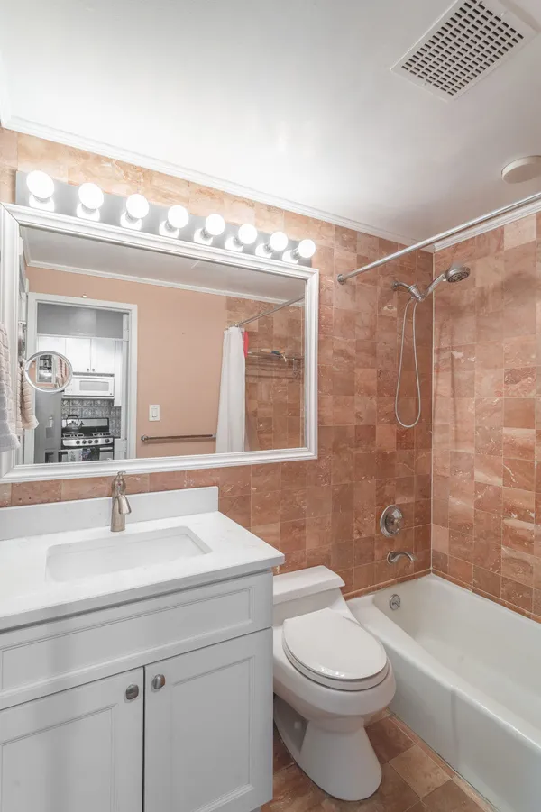 a bathroom with a sink a toilet and a bathtub