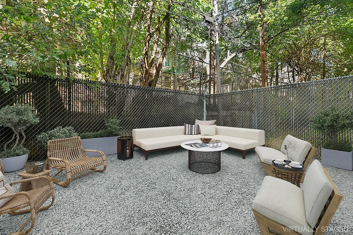 a view of a patio with couches chairs and a potted plant