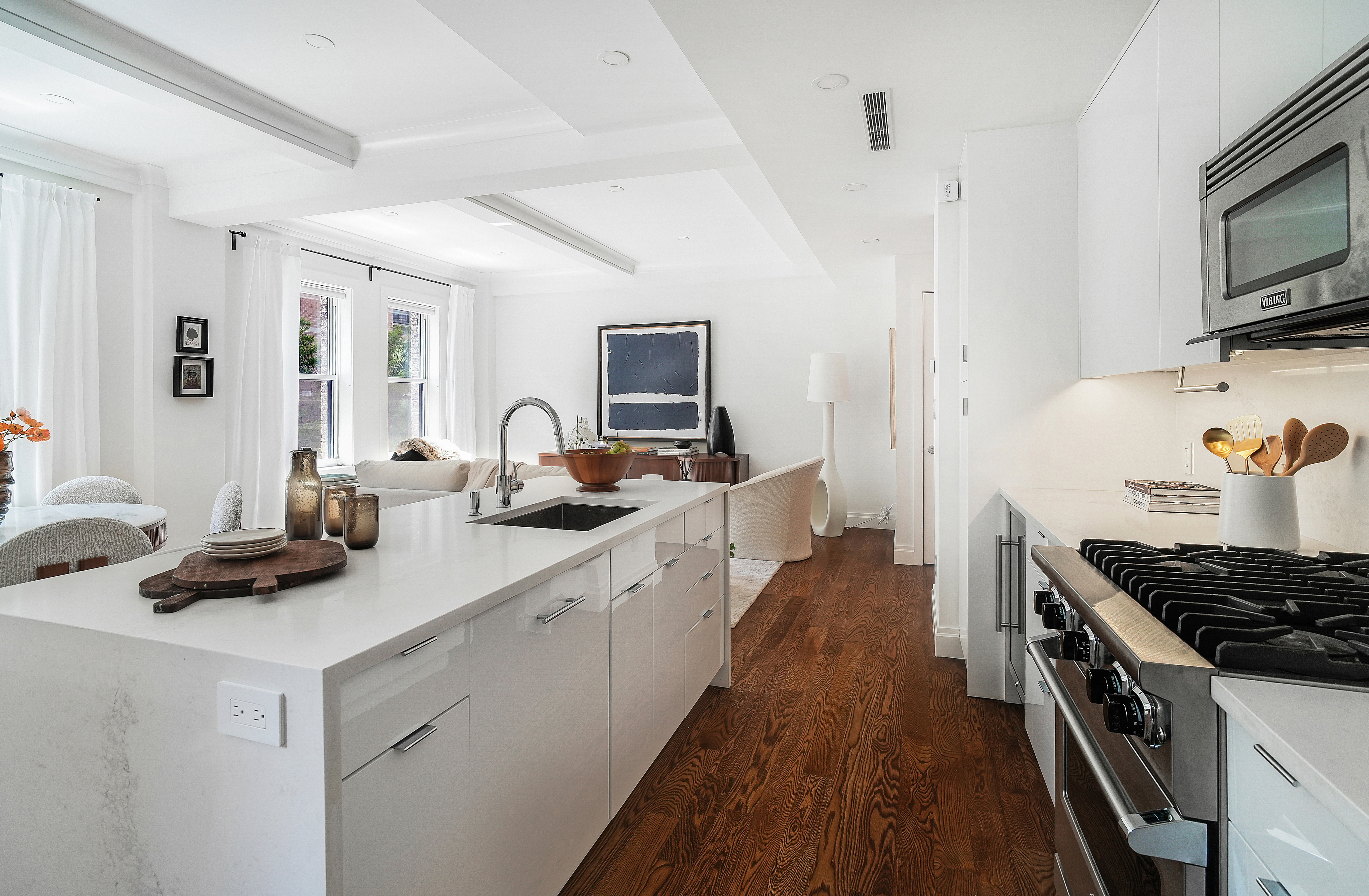 215 West 88th Street, Unit 3E Manhattan, NY 10024 - Photo 3 of 16 a kitchen with sink a stove and cabinets