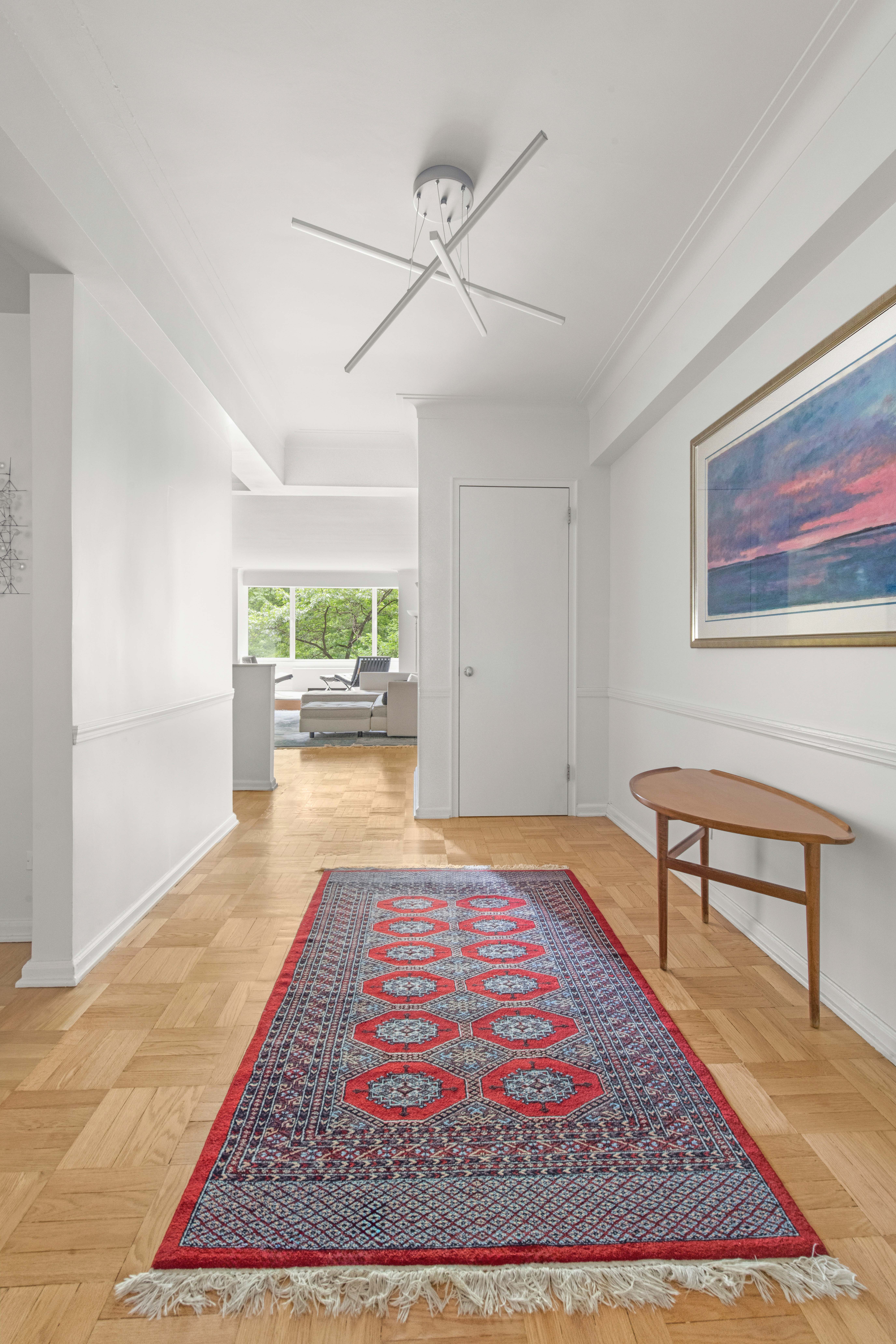 860 5th Avenue, Unit 3H Manhattan, NY 10065 - Photo 9 of 17 a living room with a rug