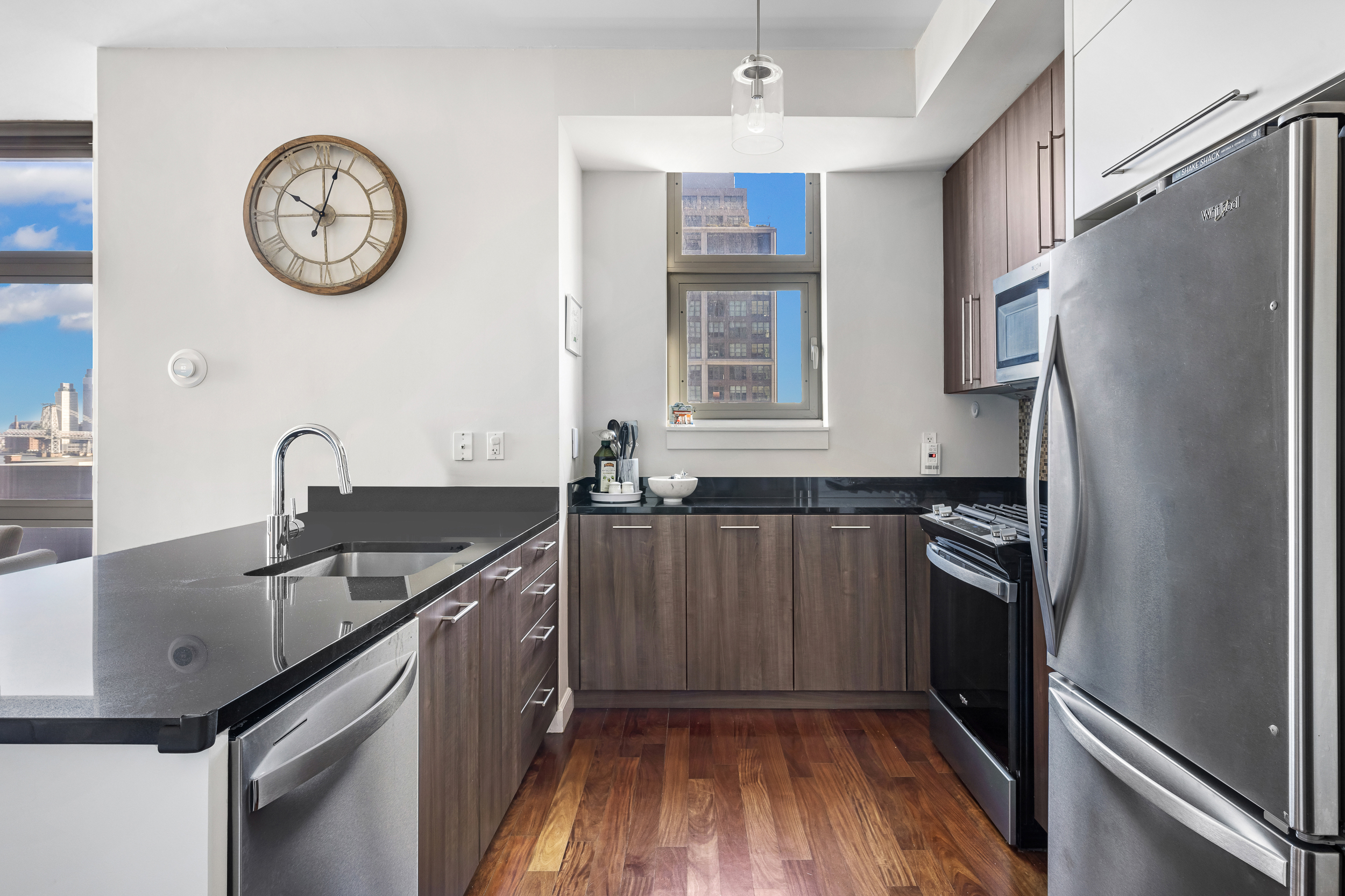 100 Jay Street, Unit 15C Brooklyn, NY 11201 - Photo 8 of 19 a kitchen with stainless steel appliances granite countertop a refrigerator a sink and a stove