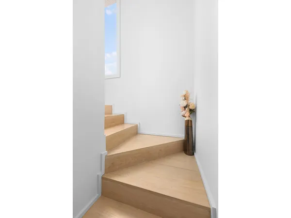 a view of a hallway with toilet