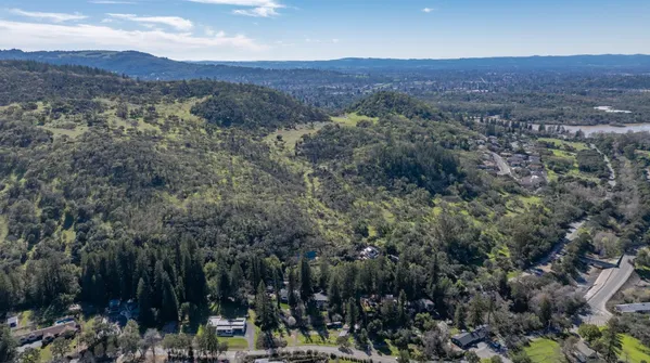an aerial view of residential house and green space