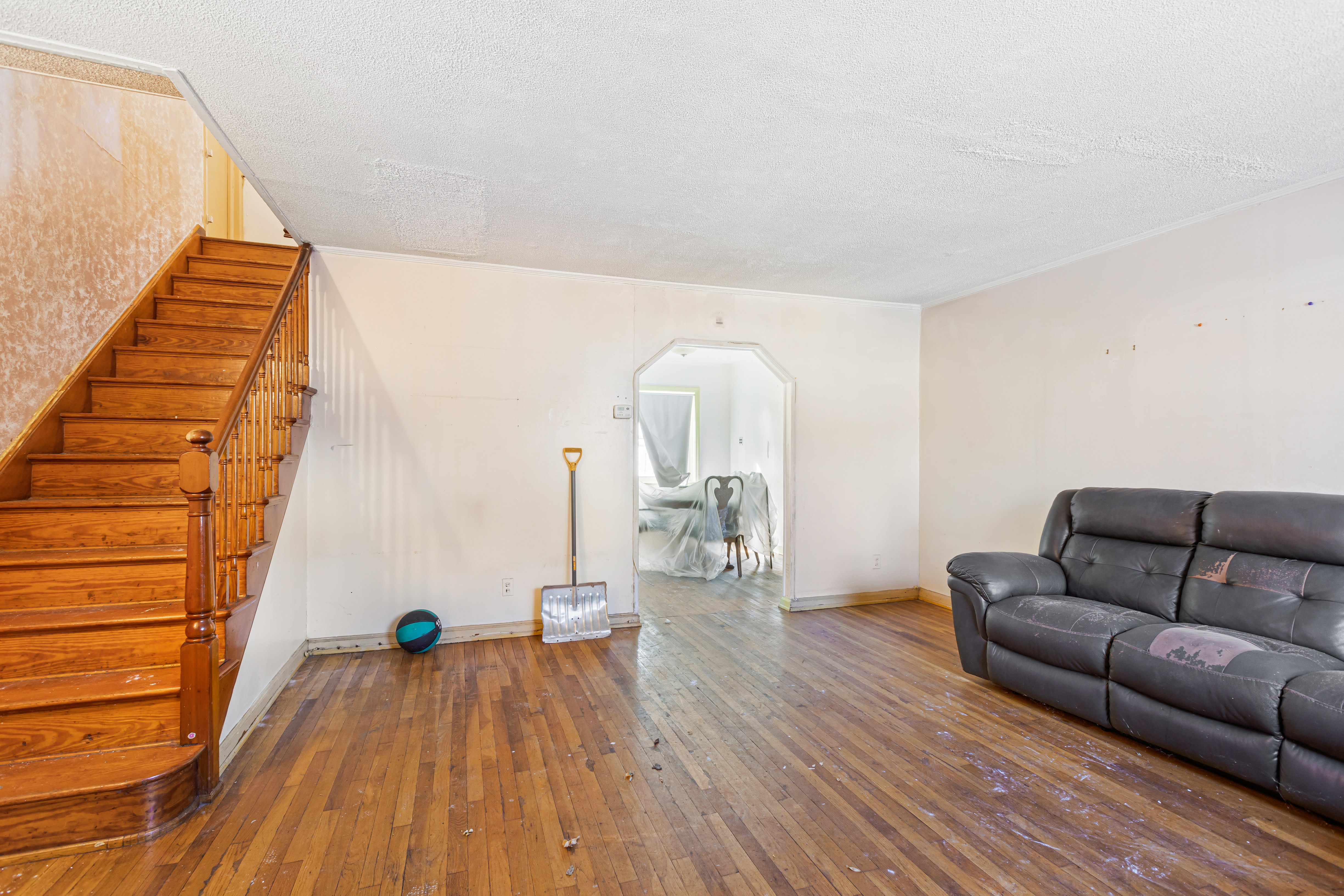 4802 6th Avenue Brooklyn, NY 11220 - Photo 13 of 21 a living room with furniture and wooden floor