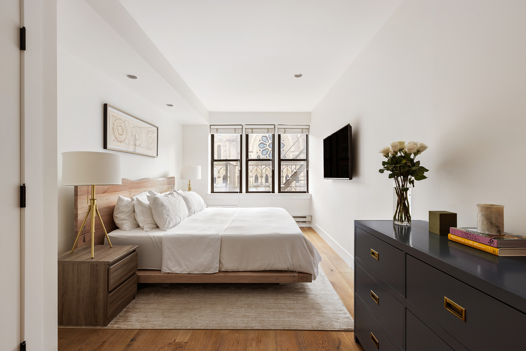 331 West 14th Street, Unit 4AB Manhattan, NY 10014 - Photo 6 of 11 a bedroom with a bed and tv