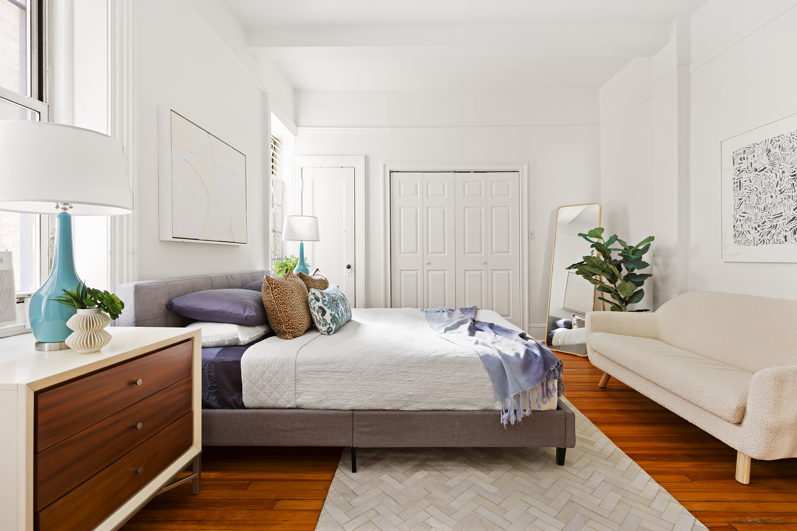 615 West 113th Street, Unit 3132 Manhattan, NY 10025 - Photo 5 of 13 a bedroom with a bed potted plant on the dresser and a potted plant