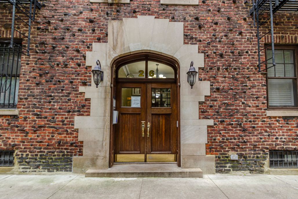 a front view of a building with a street