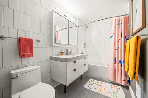 a bedroom with furniture and a wooden floor