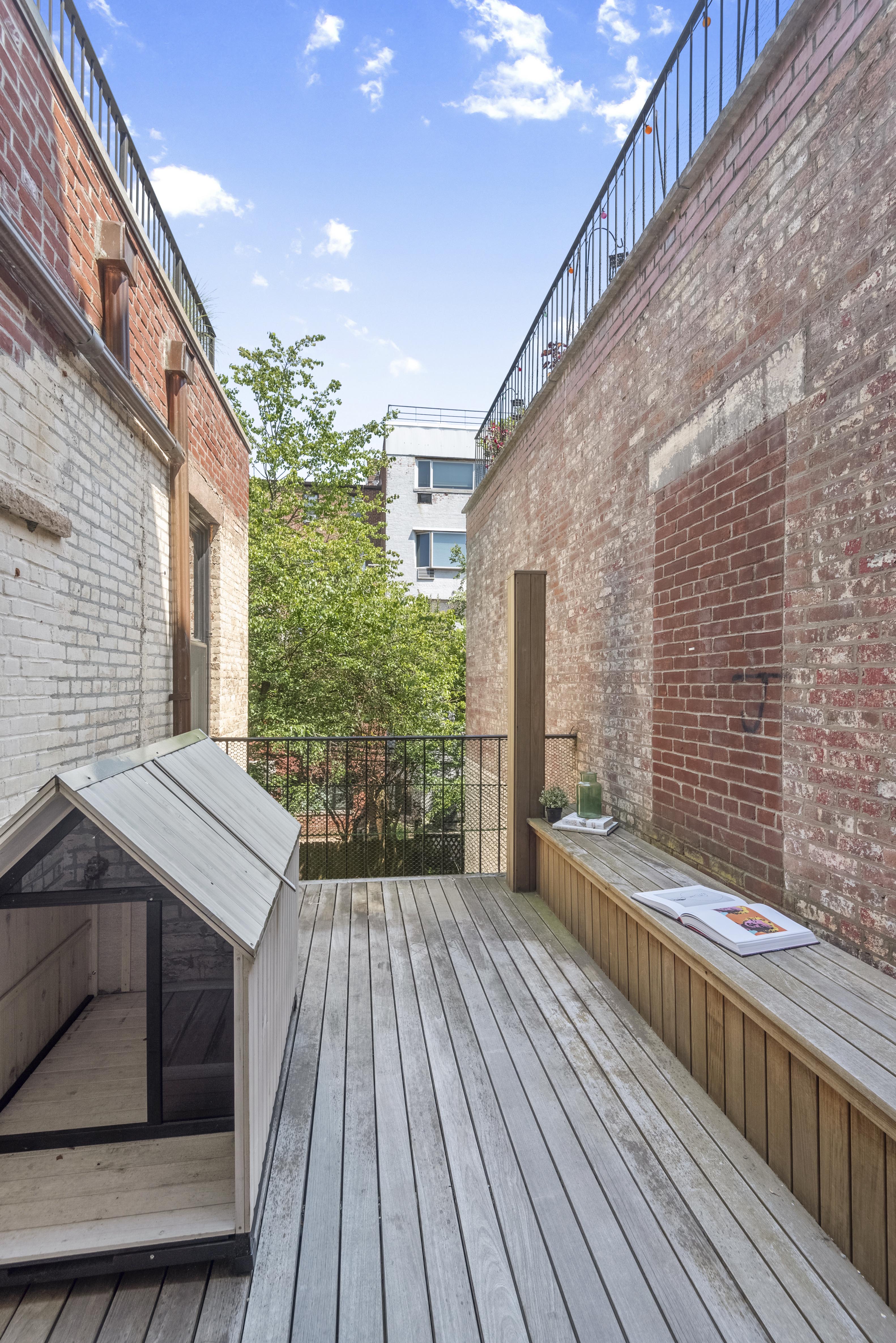 9 Garden Place, Unit 2 Brooklyn, NY 11201 - Photo 11 of 18 a porch with seating space and yard