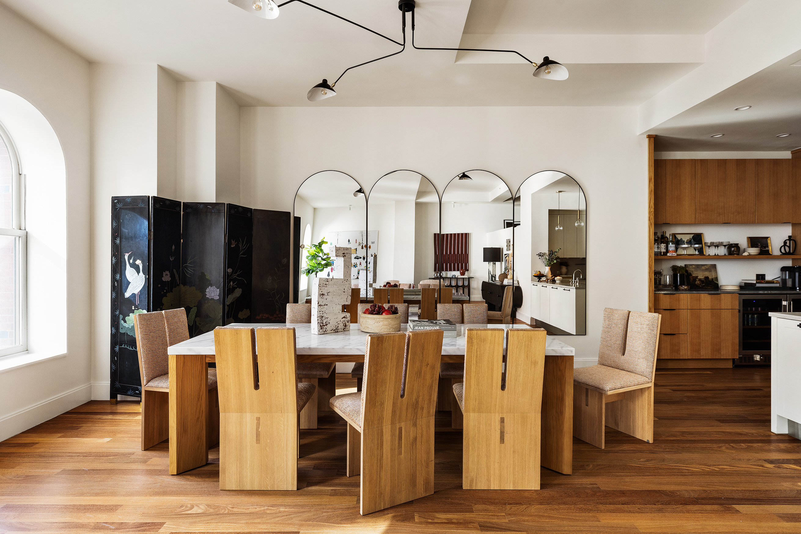 92 Laight Street, Unit 5E Manhattan, NY 10013 - Photo 7 of 26 a very nice looking dining room with kitchen island stainless steel appliances refrigerator and wooden floor