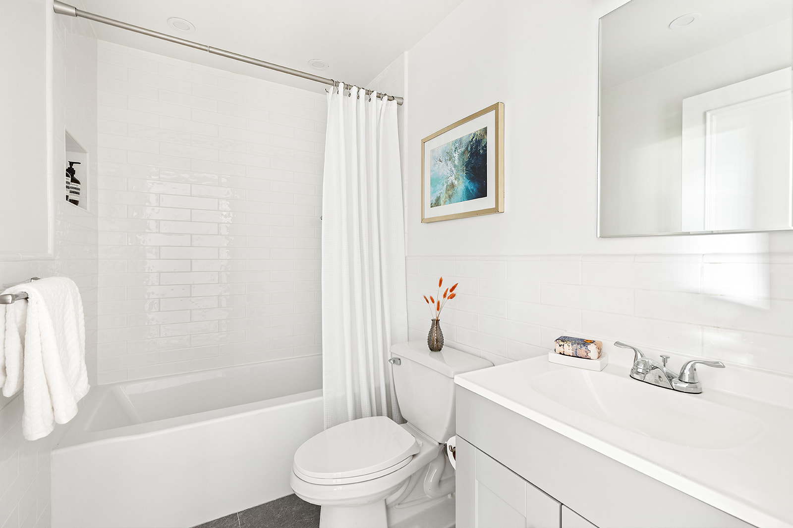 1139 Prospect Avenue, Unit 1L Brooklyn, NY 11218 - Photo 4 of 8 a bathroom with a sink a toilet and shower