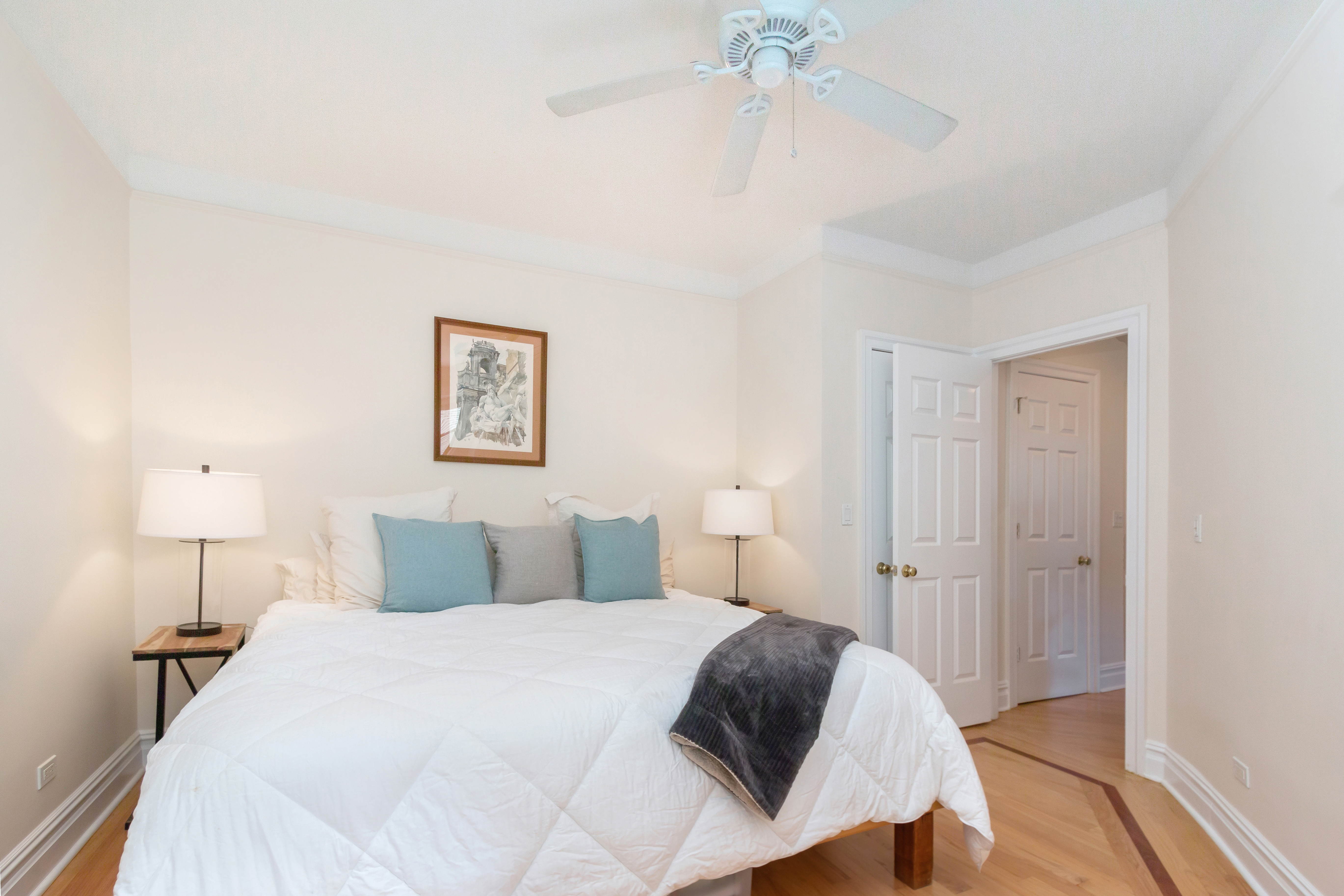 801 Riverside Drive, Unit 4F Manhattan, NY 10032 - Photo 11 of 13 a bedroom with a bed and a lamp