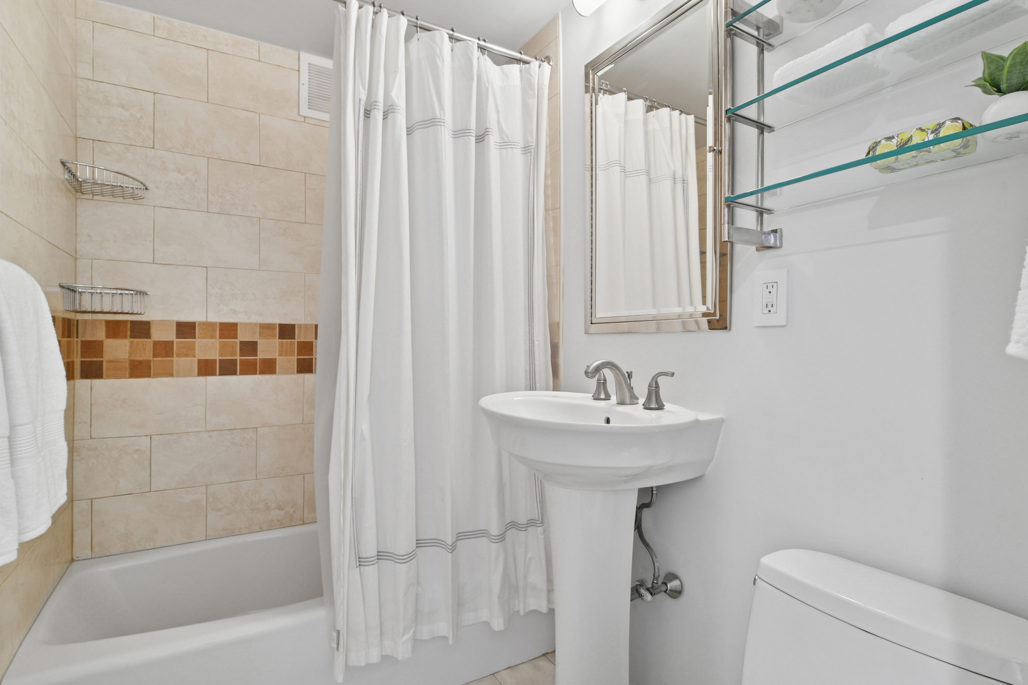 310 East 70th Street, Unit 10E Manhattan, NY 10021 - Photo 8 of 14 a bathroom with a sink a toilet and shower