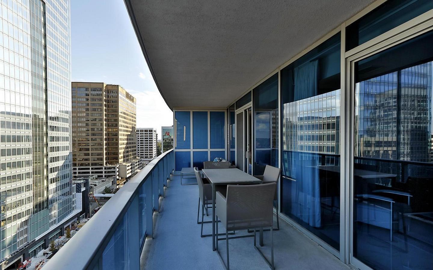 1881 North Nash Street, Unit 1009 Arlington, VA 22209 - Photo 17 of 36 a balcony with chairs and table