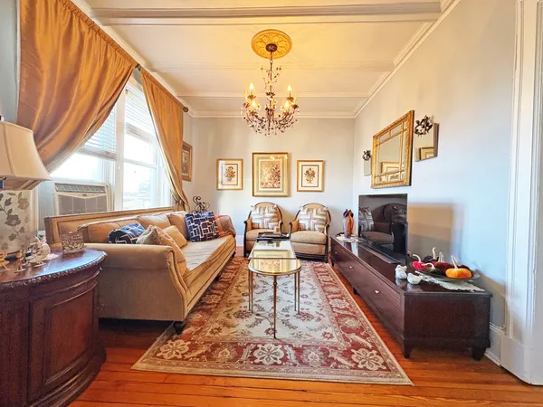 a living room with furniture fireplace and a flat screen tv