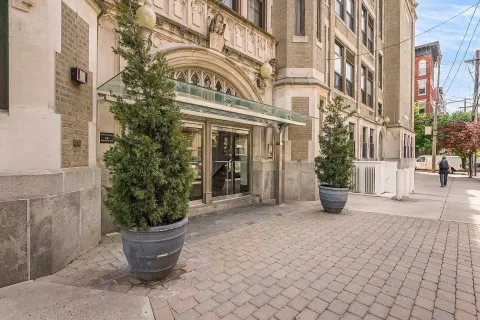 a view of a building with potted plants