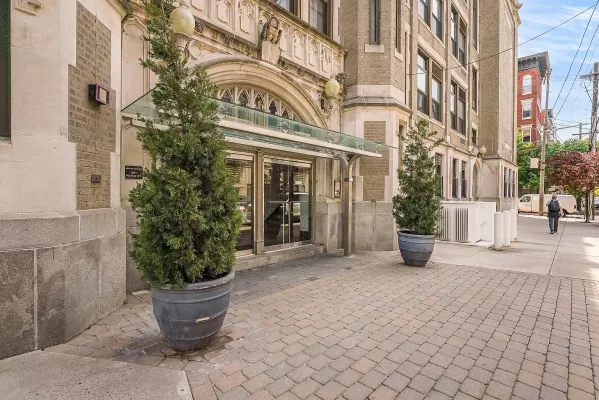 a view of a building with potted plants