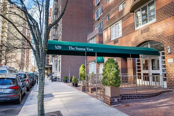 420 East 58th Street, Unit 17B Manhattan, NY 10022 - Photo 10 of 12 a view of a building with a window and pathway