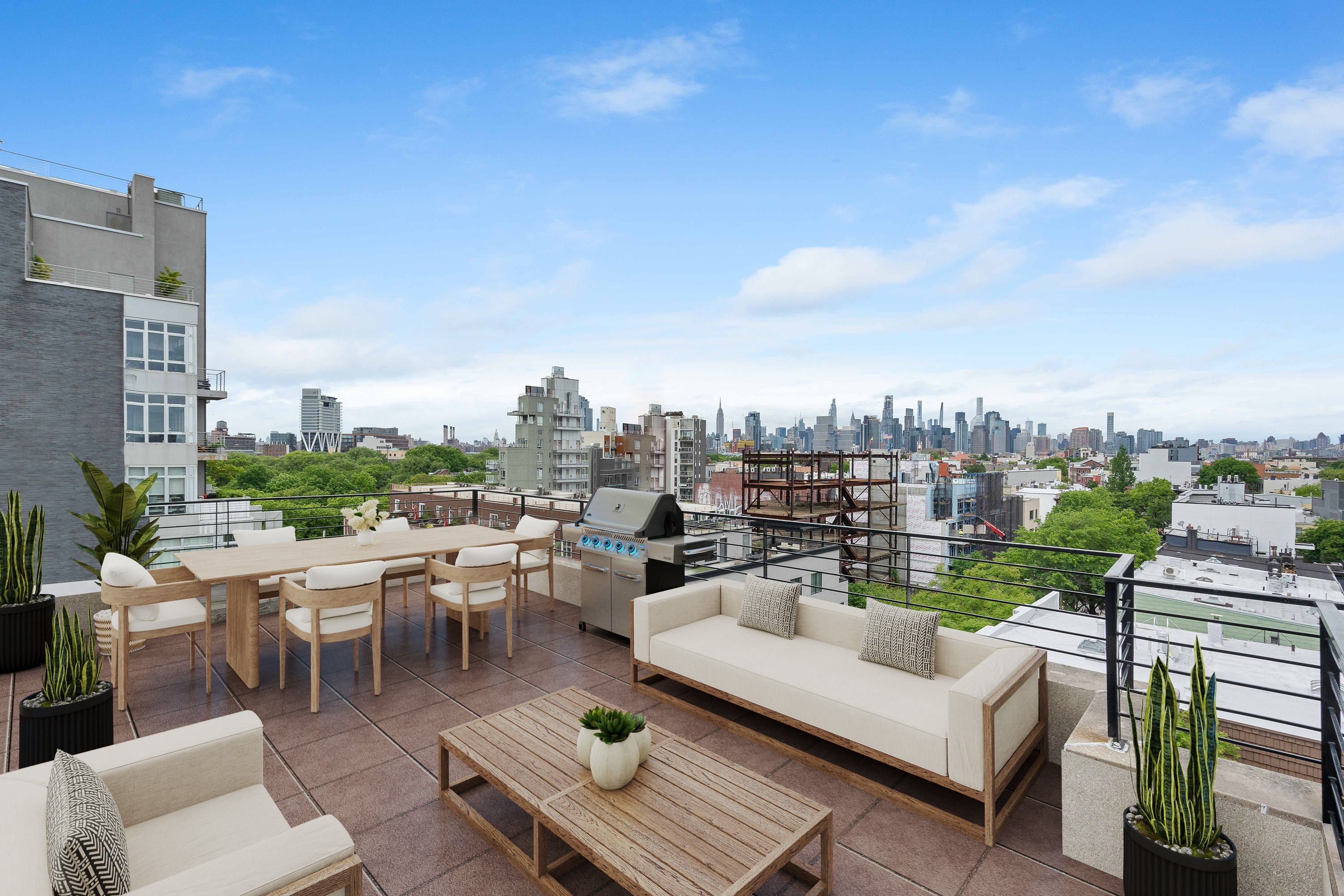 36 Eckford Street, Unit 6B Brooklyn, NY 11222 - Photo 3 of 8 a view of a roof deck with couches and potted plants