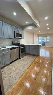 a large kitchen with stainless steel appliances lots of counter space