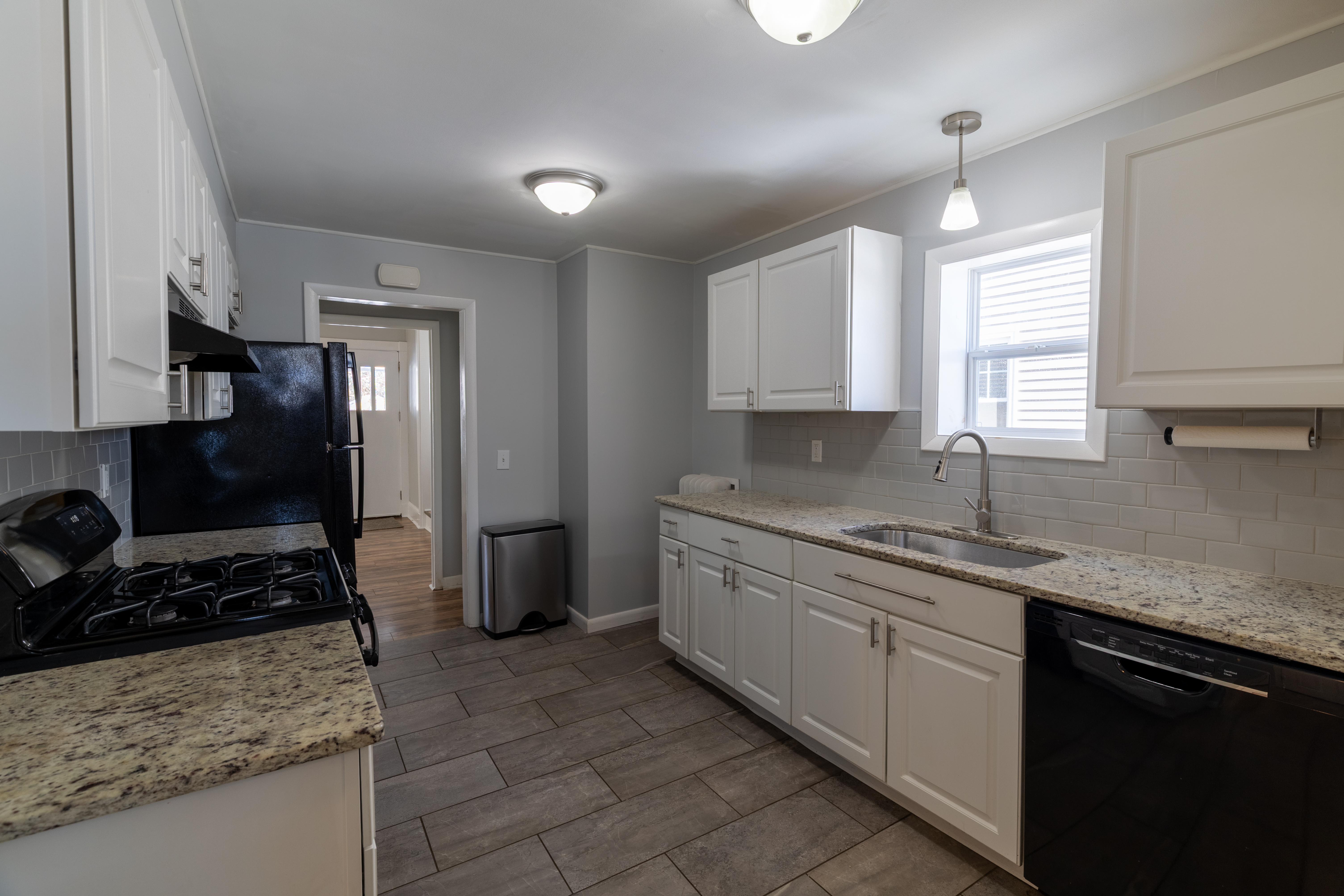 90 School Street New London, CT 06320 - Photo 9 of 34 a kitchen with a sink stove and refrigerator