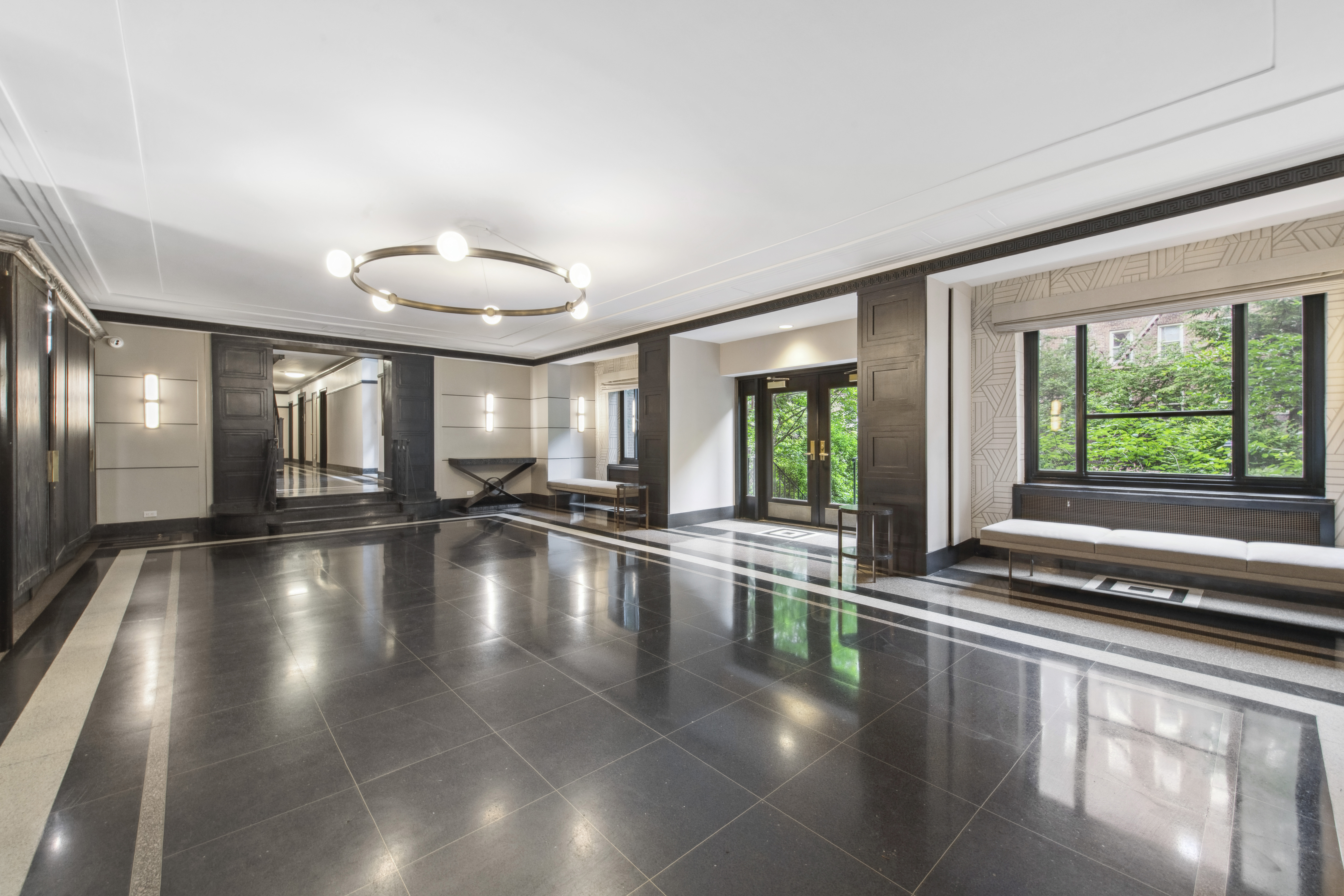 515 East 89th Street, Unit 2E Manhattan, NY 10128 - Photo 16 of 17 a view of an entryway with floor to ceiling windows in an empty room