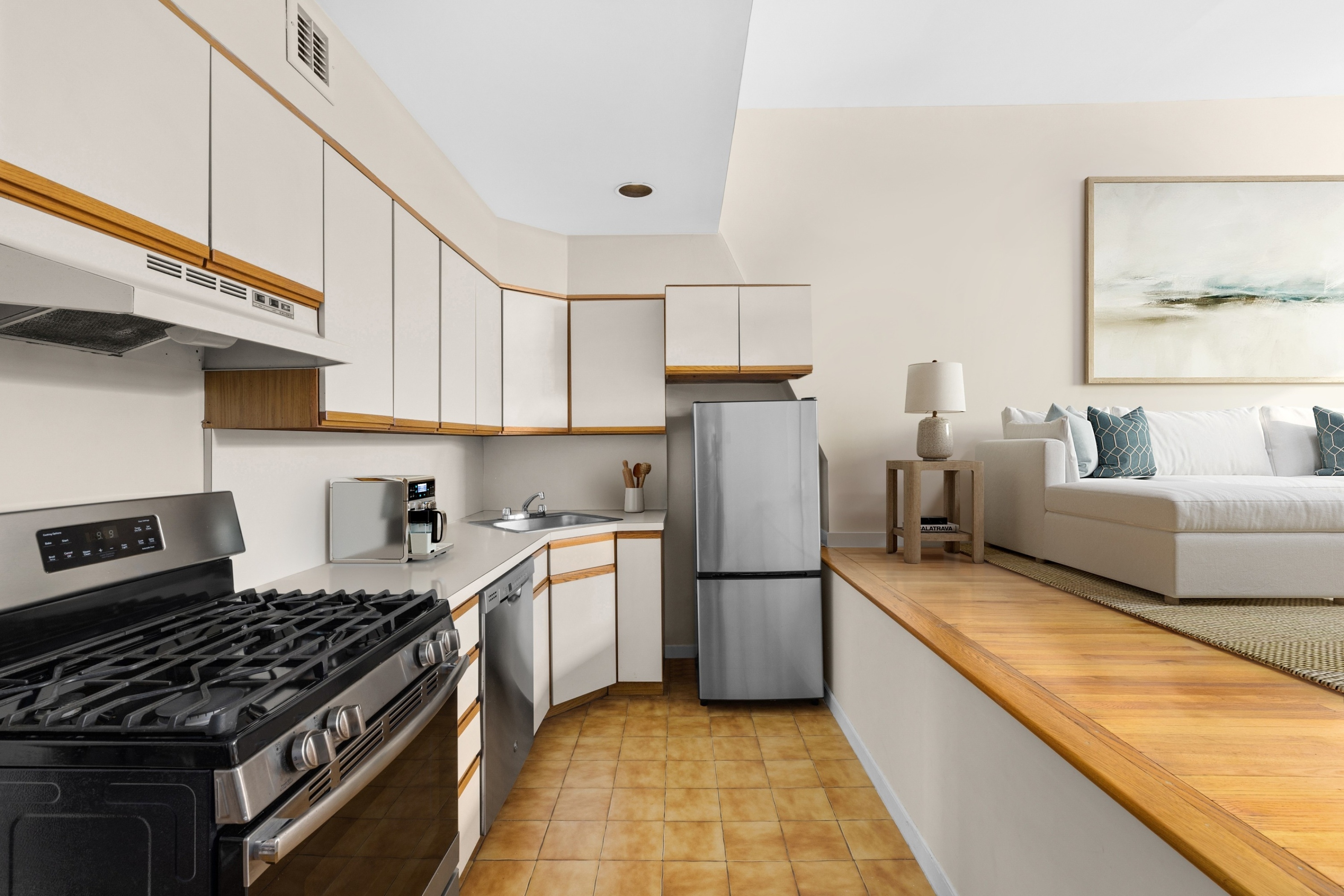 450 Clinton Street, Unit 4D Brooklyn, NY 11231 - Photo 2 of 7 a kitchen with furniture a refrigerator and a stove