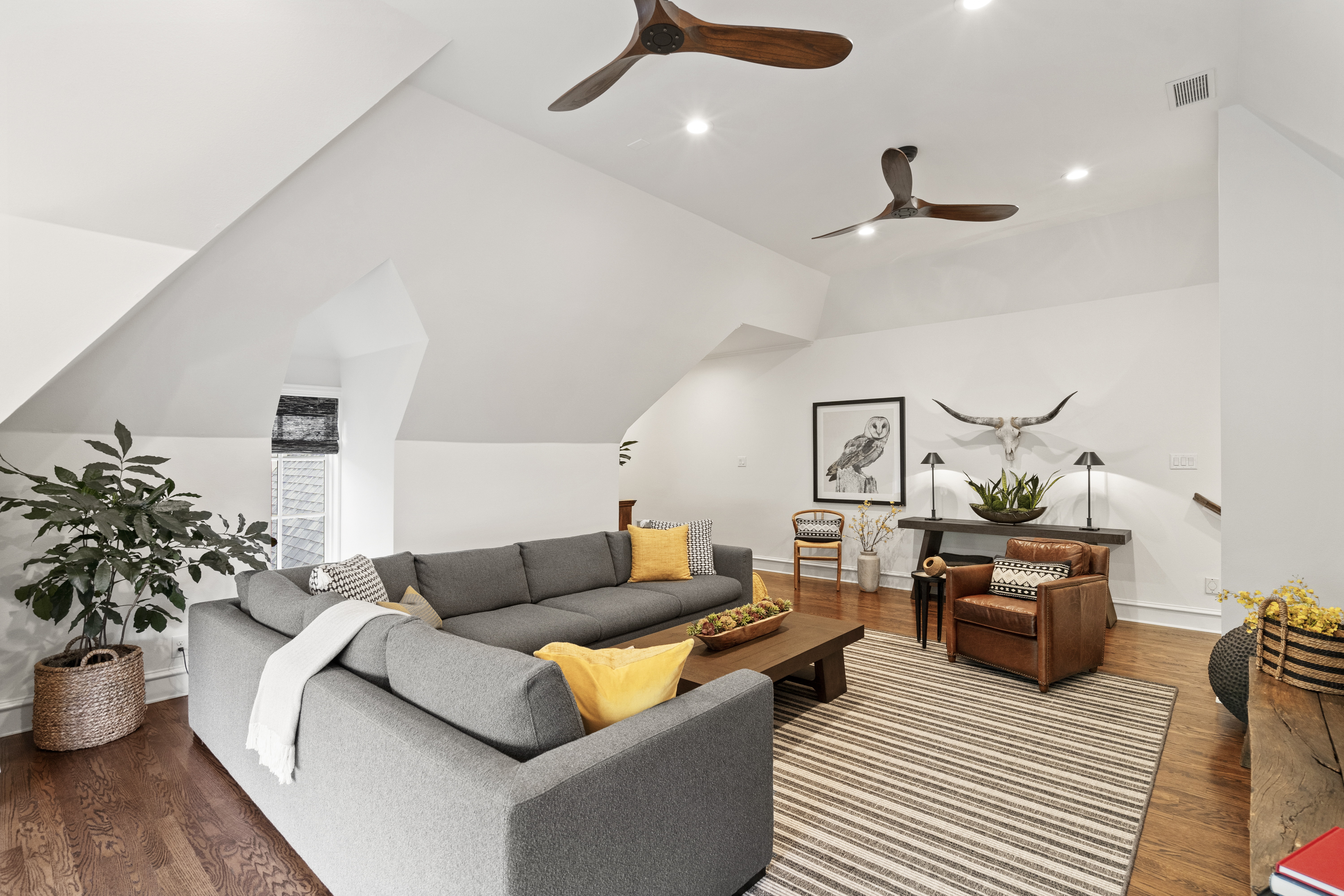 6607 Meadow Road Dallas, TX 75230 - Photo 26 of 32 a living room with furniture and wooden floor