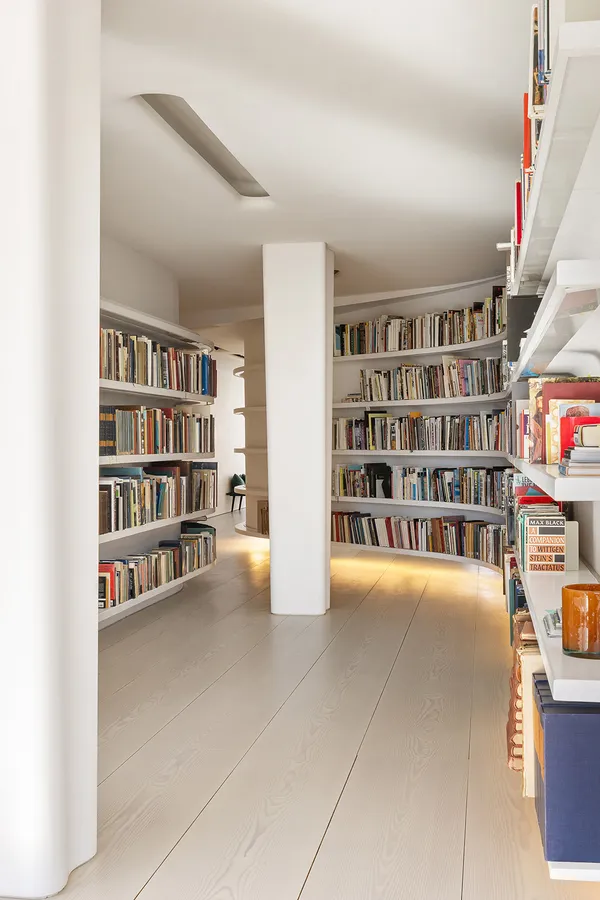 a view of an empty room with shelves