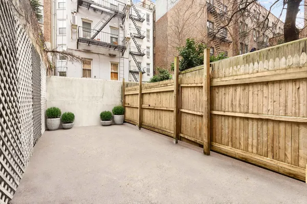a view of a balcony with wooden fence