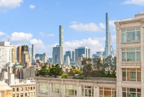 a view of a city with tall buildings