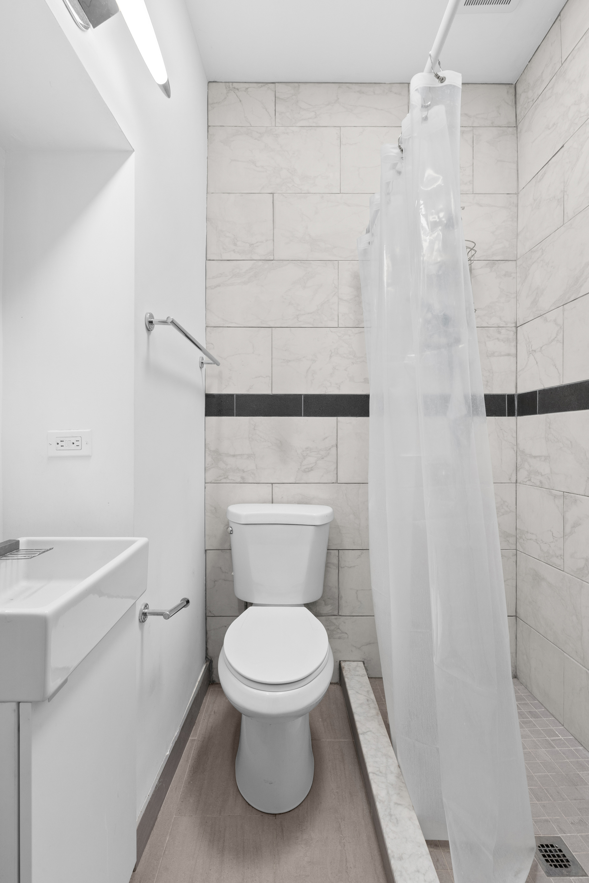 96 2nd Place Brooklyn, NY 11231 - Photo 5 of 14 a white toilet sitting next to a bathroom sink